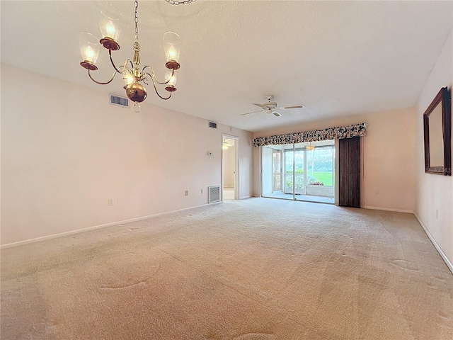 empty room featuring carpet floors and ceiling fan with notable chandelier