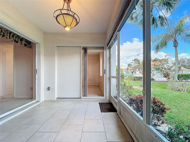 unfurnished sunroom featuring a wealth of natural light