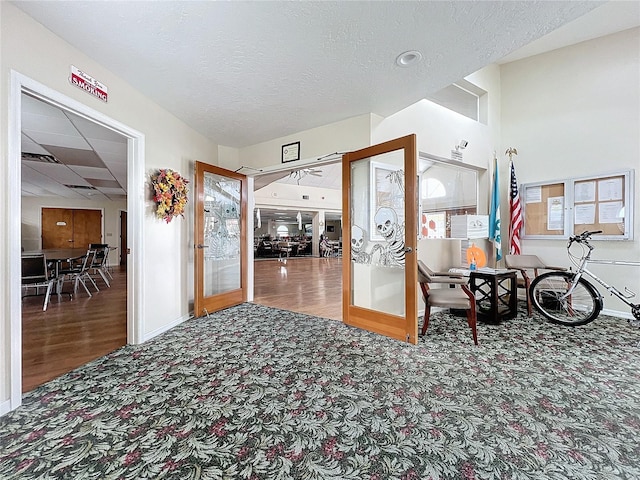 entryway with french doors and hardwood / wood-style floors