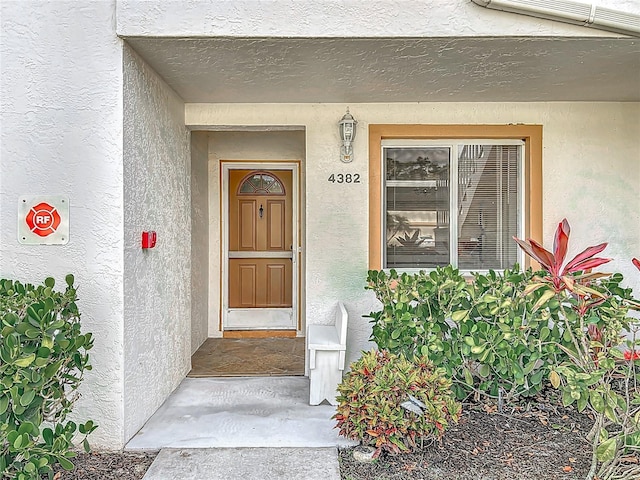 4382 Madeira Ct Unit 3361, Sarasota, FL 34233 - doorway to property with stucco siding