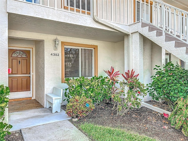 4382 Madeira Ct Unit 3361, Sarasota, FL 34233 - view of exterior entry with stucco siding and board and batten siding