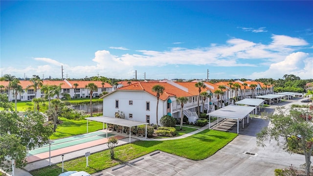 4382 Madeira Ct Unit 3361, Sarasota, FL 34233 - view of home's community featuring a residential view, shuffleboard, a yard, and uncovered parking