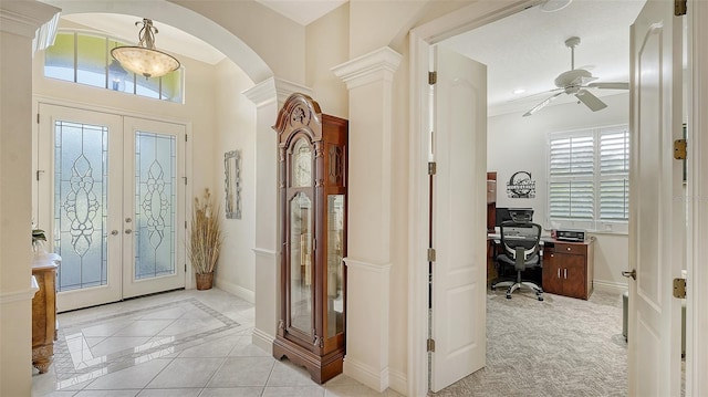 21 Bayhead Ln, Osprey, FL 34229 - foyer featuring french doors, a ceiling fan, arched walkways, baseboards, and inlaid floor details