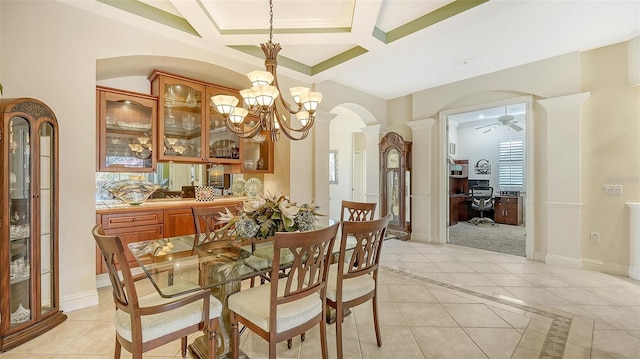 21 Bayhead Ln, Osprey, FL 34229 - dining area featuring arched walkways, a chandelier, decorative columns, a desk, and coffered ceiling