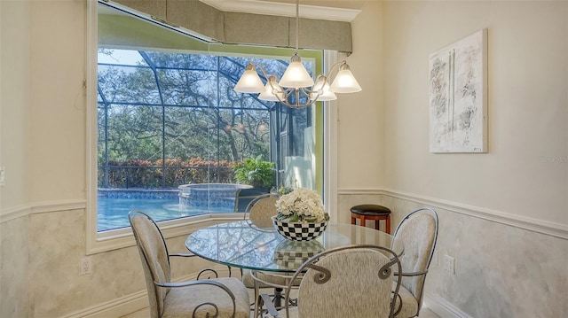 21 Bayhead Ln, Osprey, FL 34229 - dining room with wainscoting and a chandelier