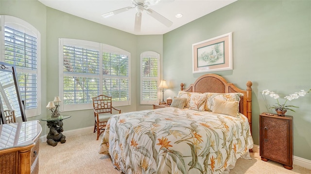 bedroom featuring ceiling fan and light colored carpet