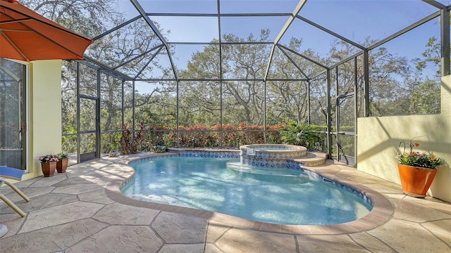 view of pool featuring a patio area, a lanai, and an in ground hot tub