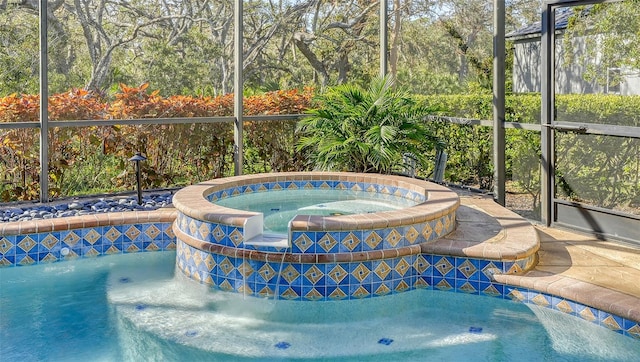 view of pool featuring an in ground hot tub