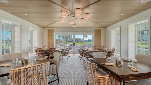21 Bayhead Ln, Osprey, FL 34229 - dining space featuring wood ceiling, a chandelier, and carpet floors