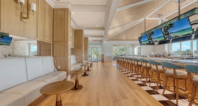 21 Bayhead Ln, Osprey, FL 34229 - bar featuring light wood-type flooring and tasteful backsplash