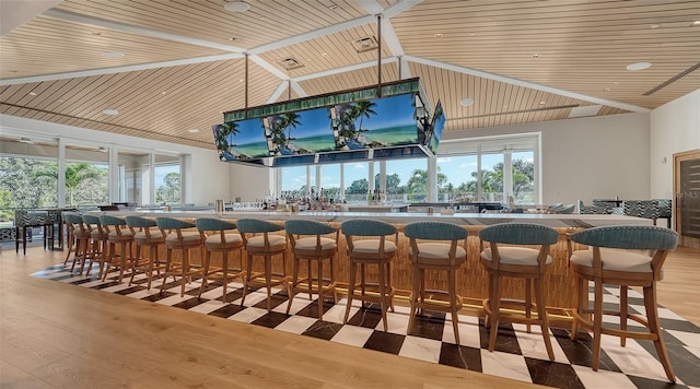 21 Bayhead Ln, Osprey, FL 34229 - dining space featuring wooden ceiling, plenty of natural light, light wood-style floors, and high vaulted ceiling