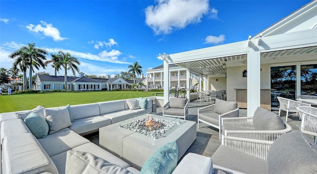 view of patio / terrace with an outdoor living space with a fire pit