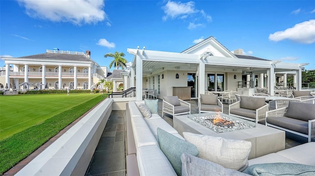 21 Bayhead Ln, Osprey, FL 34229 - view of patio / terrace with an outdoor living space with a fire pit