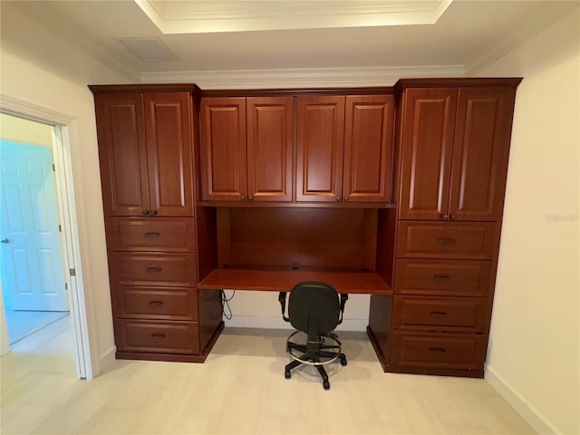 office with light wood finished floors, baseboards, and crown molding