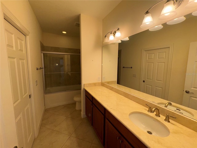 full bathroom with toilet, enclosed tub / shower combo, vanity, and tile patterned floors