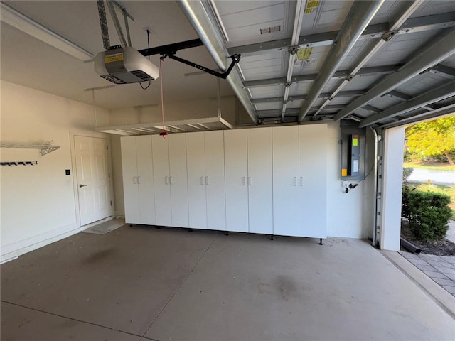 garage featuring a garage door opener and electric panel