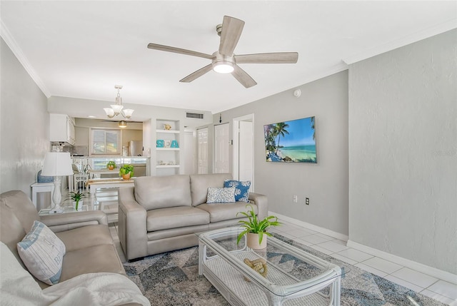 tiled living room with ornamental molding and ceiling fan with notable chandelier