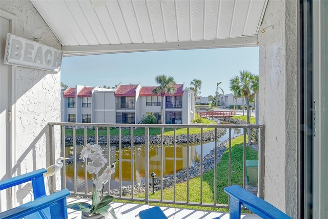 balcony featuring a water view