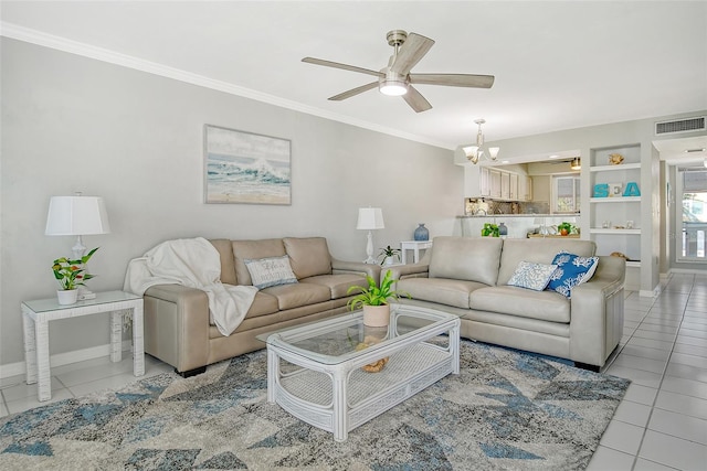 tiled living room with crown molding, built in shelves, and ceiling fan with notable chandelier