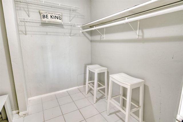 spacious closet featuring tile patterned flooring