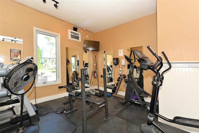 exercise room featuring a wall unit AC