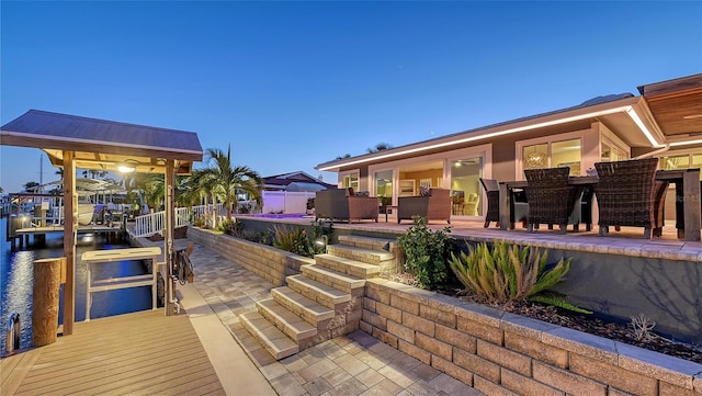 patio terrace at dusk with a water view