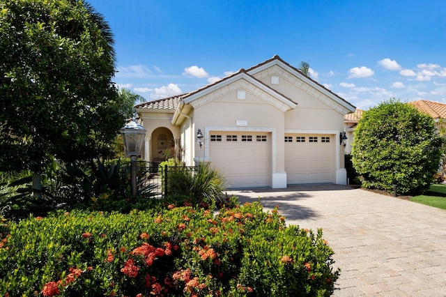 view of front of property with a garage