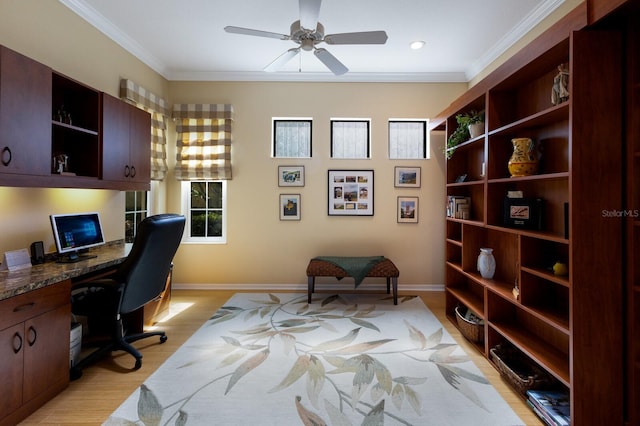 home office with light hardwood / wood-style flooring, built in desk, crown molding, and ceiling fan