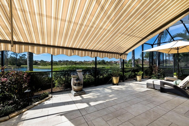 view of patio with a water view