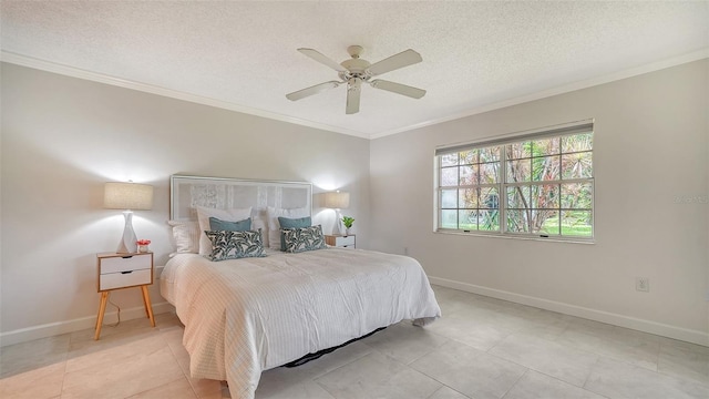 bedroom with ornamental molding, ceiling fan, a textured ceiling, and baseboards