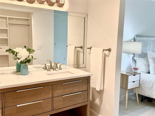 bathroom featuring vanity and baseboards