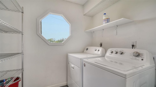 clothes washing area featuring laundry area and independent washer and dryer