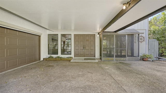 view of exterior entry featuring a garage