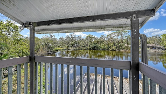 wooden terrace featuring a water view