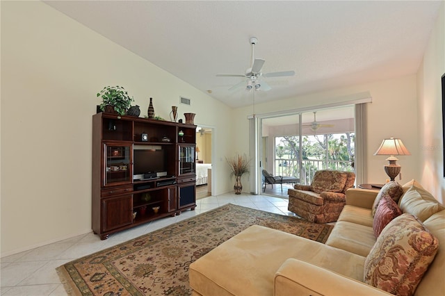 tiled living room featuring vaulted ceiling and ceiling fan