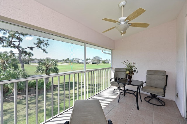 sunroom / solarium with vaulted ceiling and ceiling fan