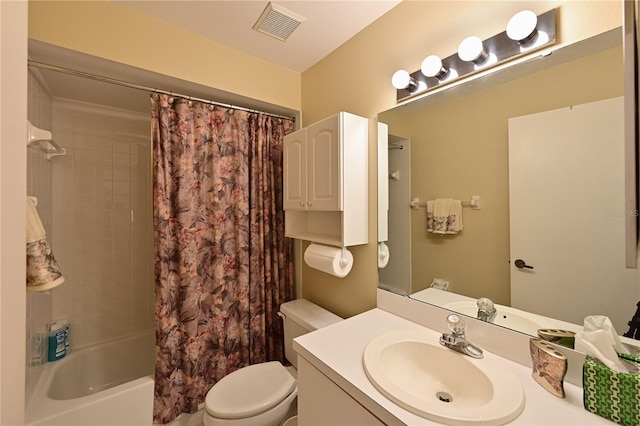 full bathroom featuring vanity, shower / tub combo, and toilet