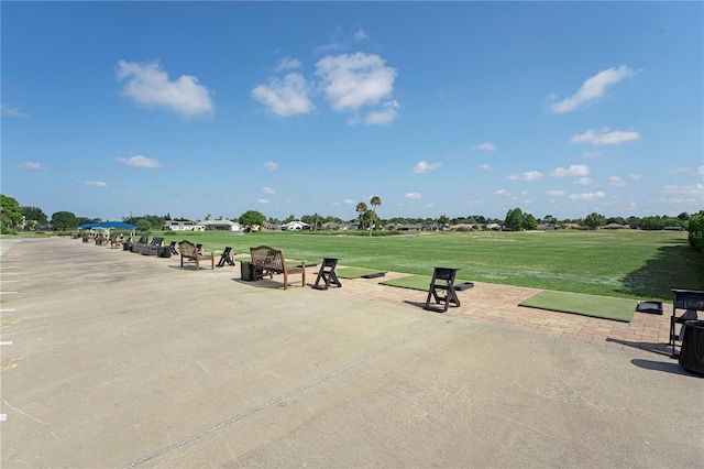 view of property's community with a lawn