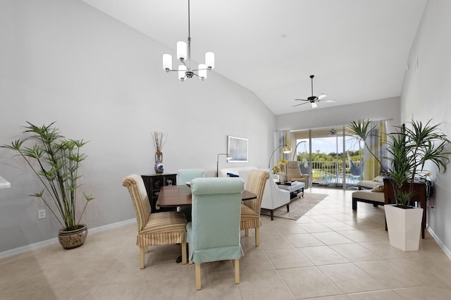 tiled dining space with lofted ceiling and ceiling fan with notable chandelier