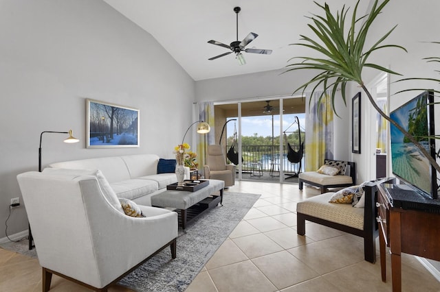 living room featuring light tile patterned flooring, ceiling fan, and high vaulted ceiling