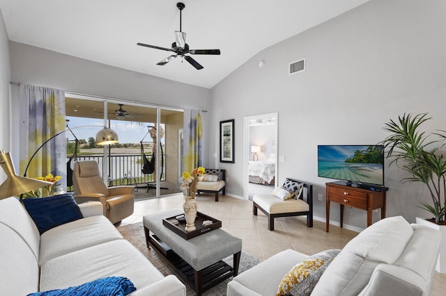 tiled living room with high vaulted ceiling and ceiling fan