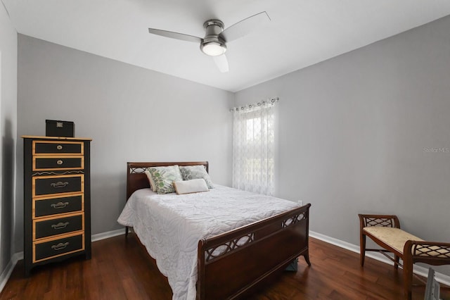 bedroom featuring ceiling fan and dark hardwood / wood-style flooring