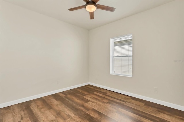 unfurnished room featuring dark wood-type flooring and ceiling fan