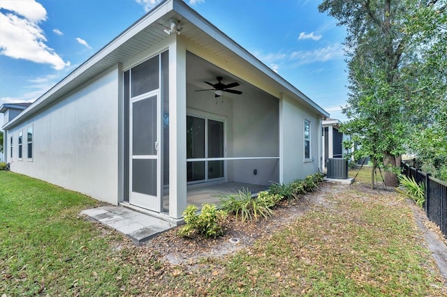 back of house featuring a patio, central air condition unit, a lawn, and ceiling fan