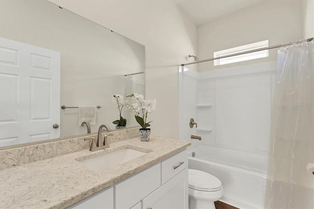 full bathroom featuring toilet, shower / bath combination with curtain, and vanity