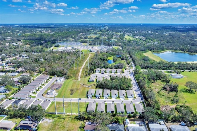 bird's eye view with a water view and a residential view