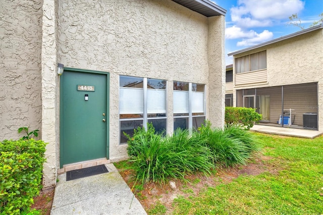 property entrance featuring central AC