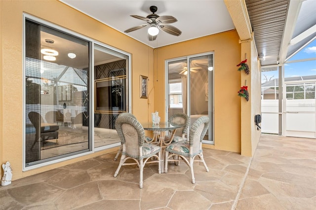 sunroom / solarium with ceiling fan