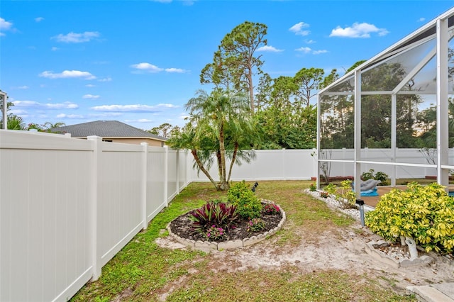 view of yard with a lanai