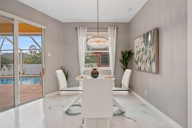 dining space featuring a notable chandelier